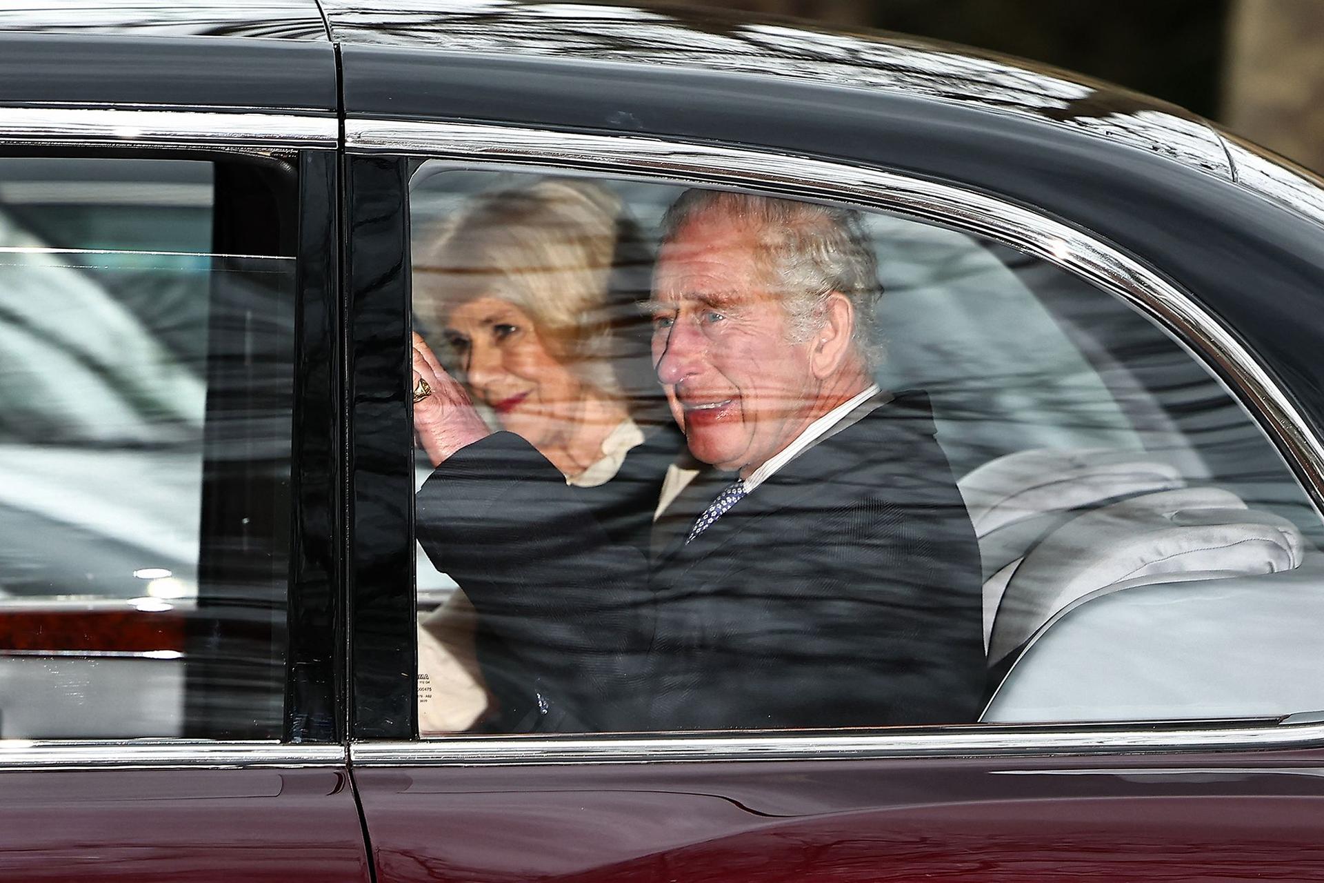 King Charles and Camilla drive to Buckingham Palace on Tuesday.