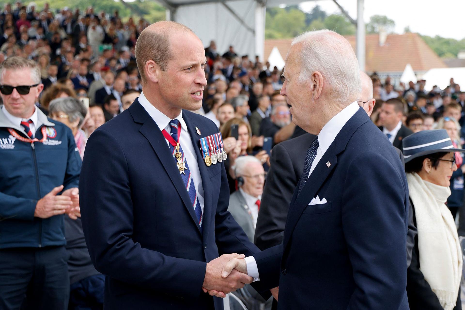 Prince William shakes hands with US President Joe Biden at the international ceremony.