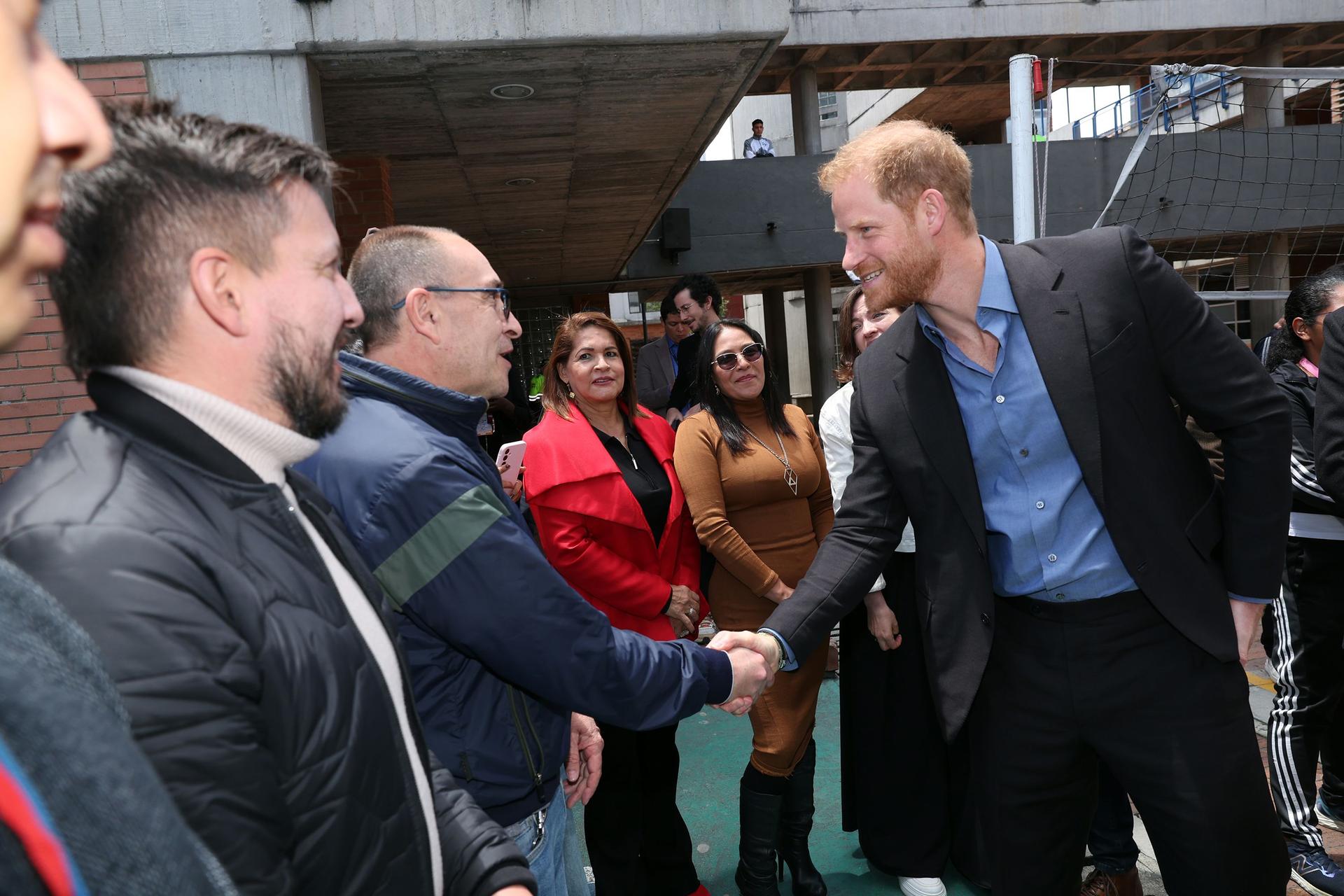 Prince Harry also stopped by a local school, Colegio Cultura Popular, on the couple's first day in Colombia. 