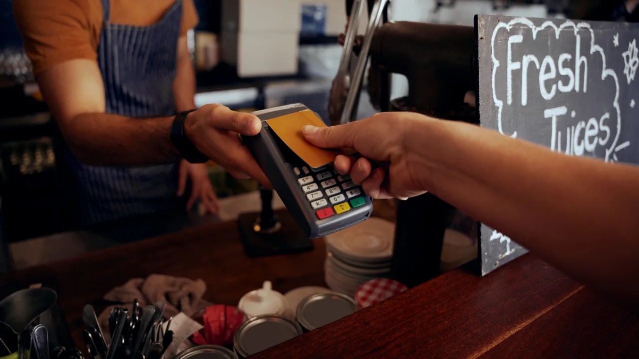 Person tapping credit card