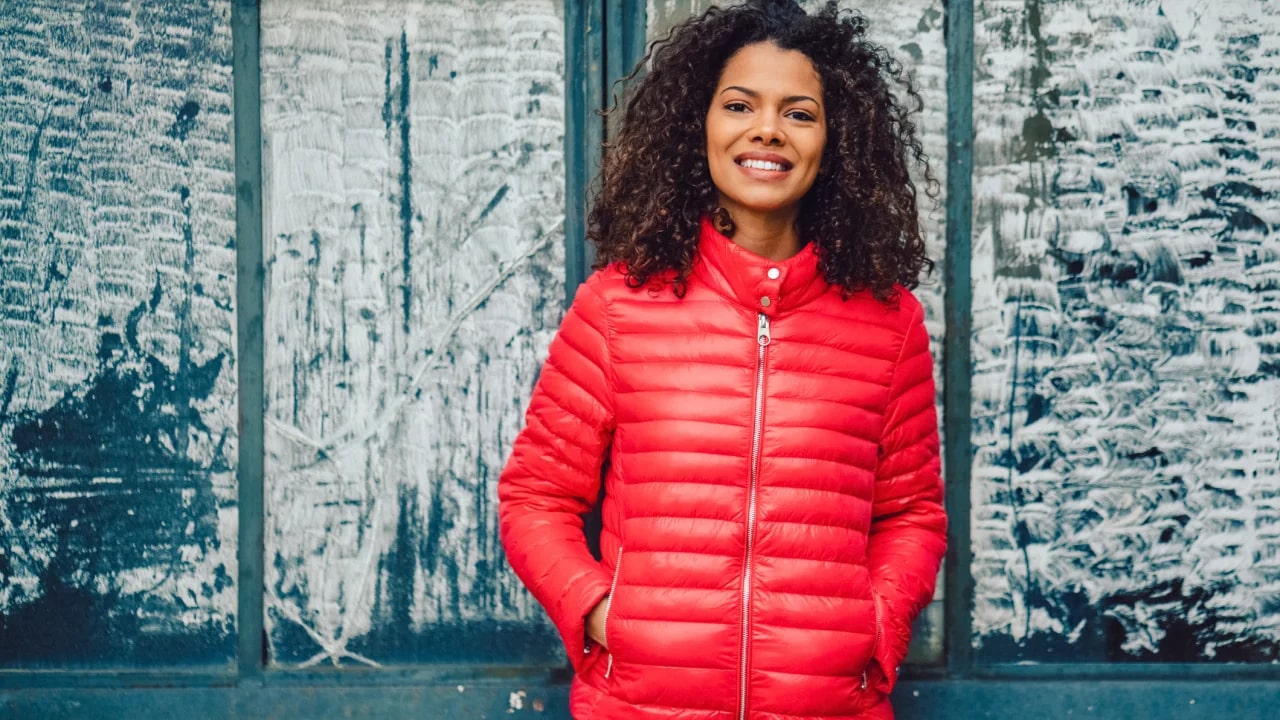 Woman wearing bright red puffer jacket