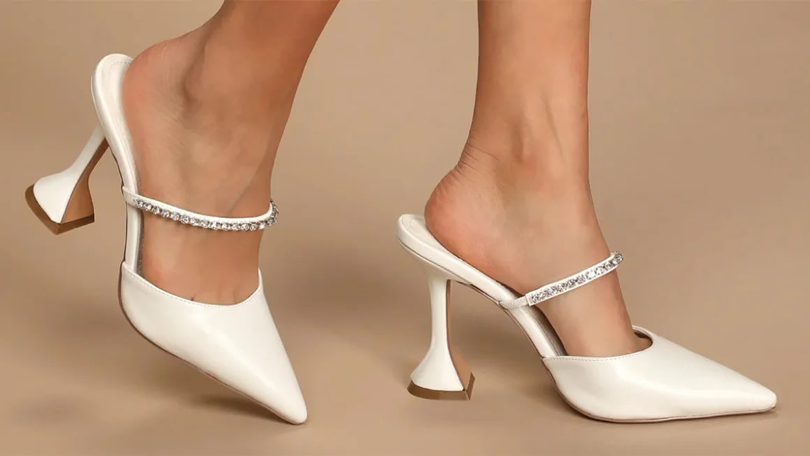 Close up of white heels on feet