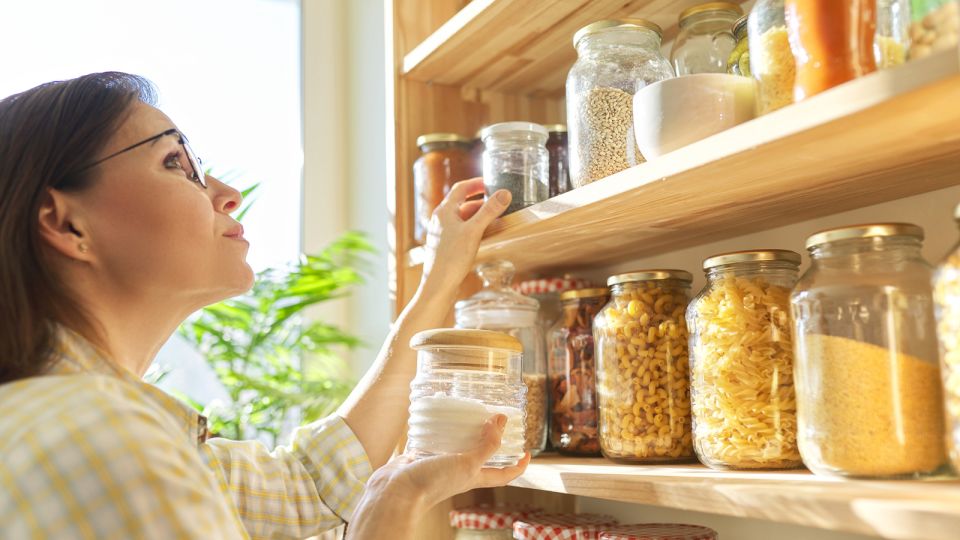 Person organizing a pantry