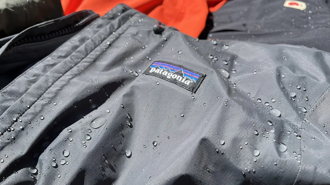 Black Patagonia jacket with beads of water