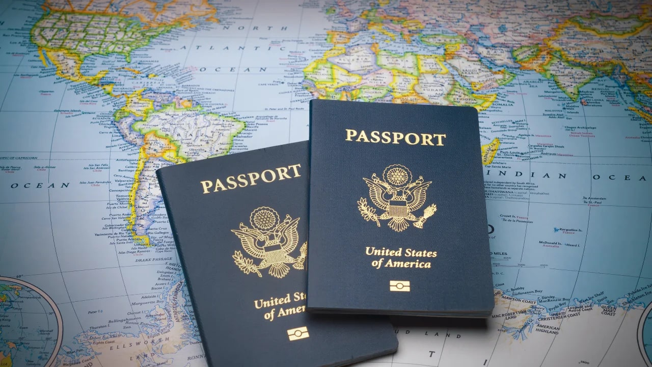 Two passports on a world globe