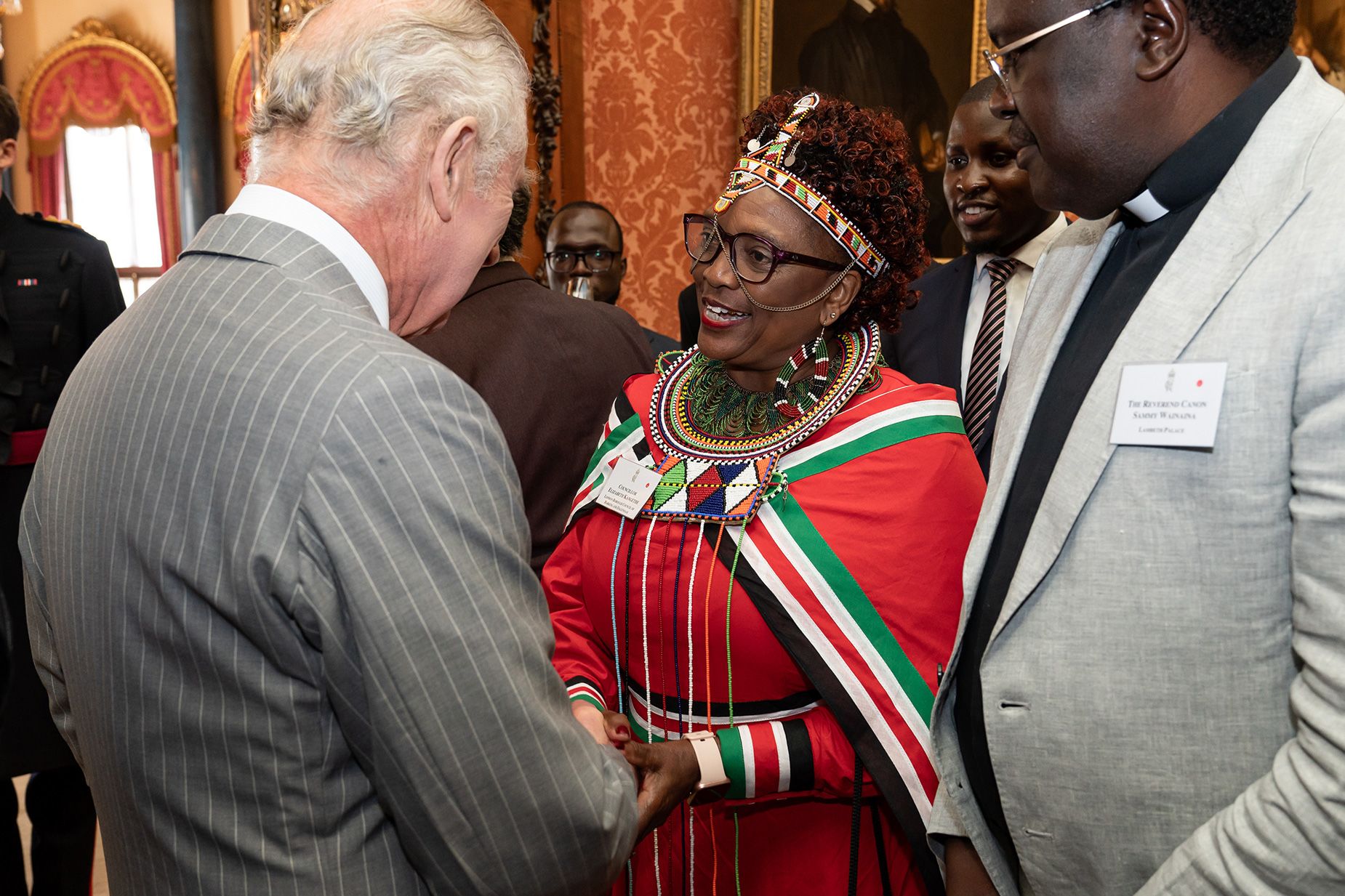 King Charles chats with guests at a reception for the Kenya diaspora at Buckingham Palace on October 24. 