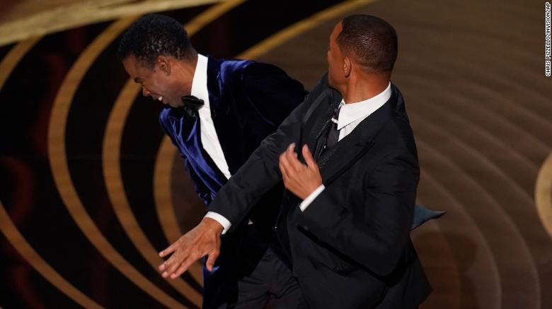 Will Smith hits presenter Chris Rock during the 2022 Academy Awards.