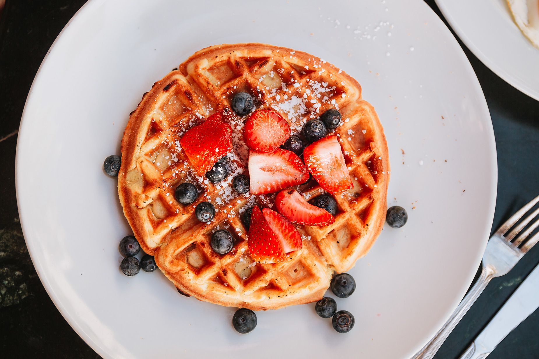 A waffle with toppings.