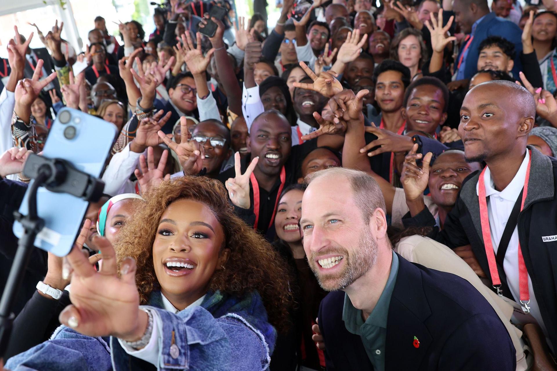 Prince William, Prince of Wales and Nomzamo Mbatha pose for a selfie with young people during the Earthshot Prize Climate Leaders Youth Programme on November 04, 2024 in Cape Town, South Africa.