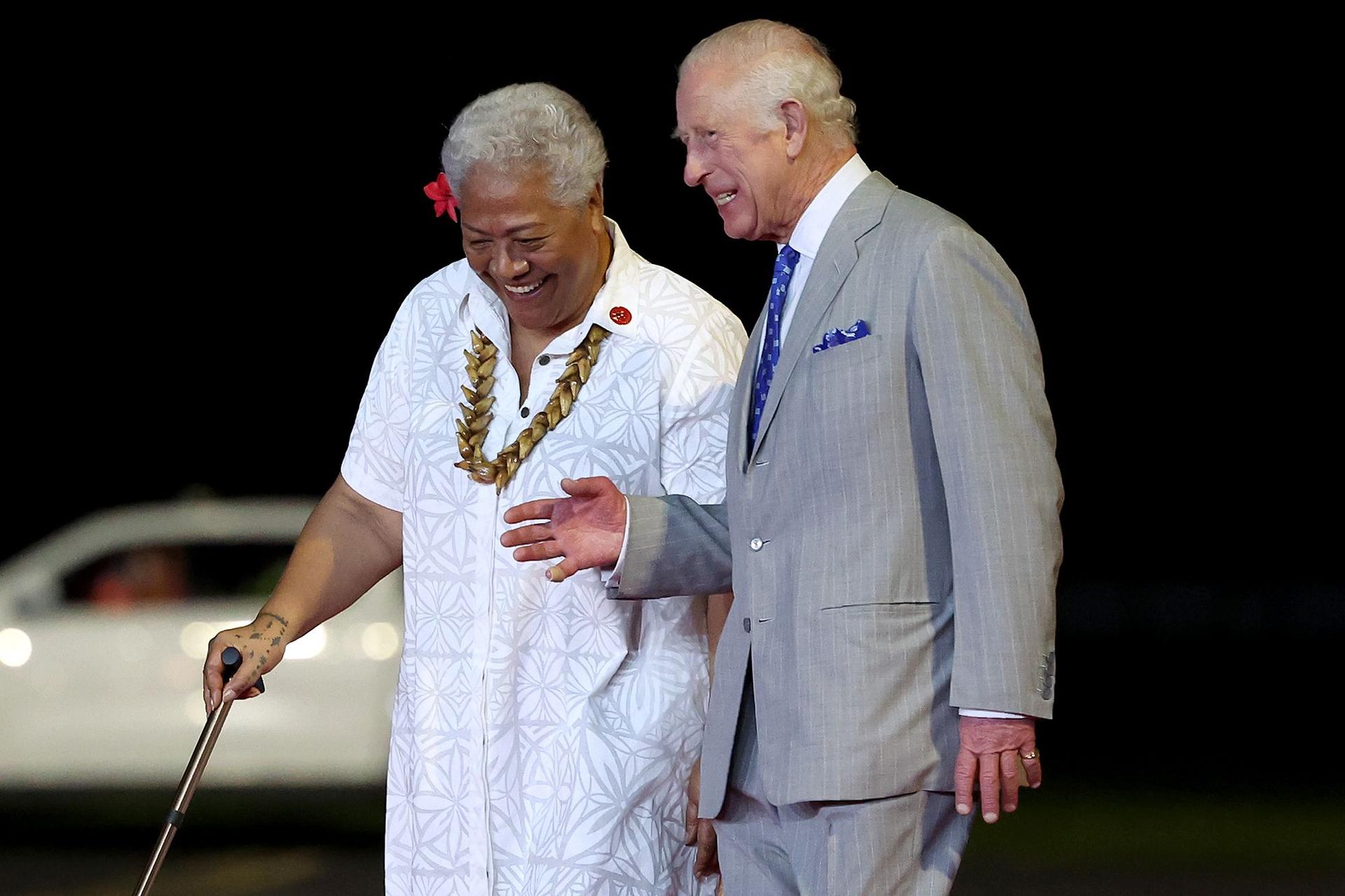 The King is welcomed to Samoa by the island nation's prime minister, Fiame Naomi Mata'afa, upon their arrival at Faleolo International Airport on Wednesday. 