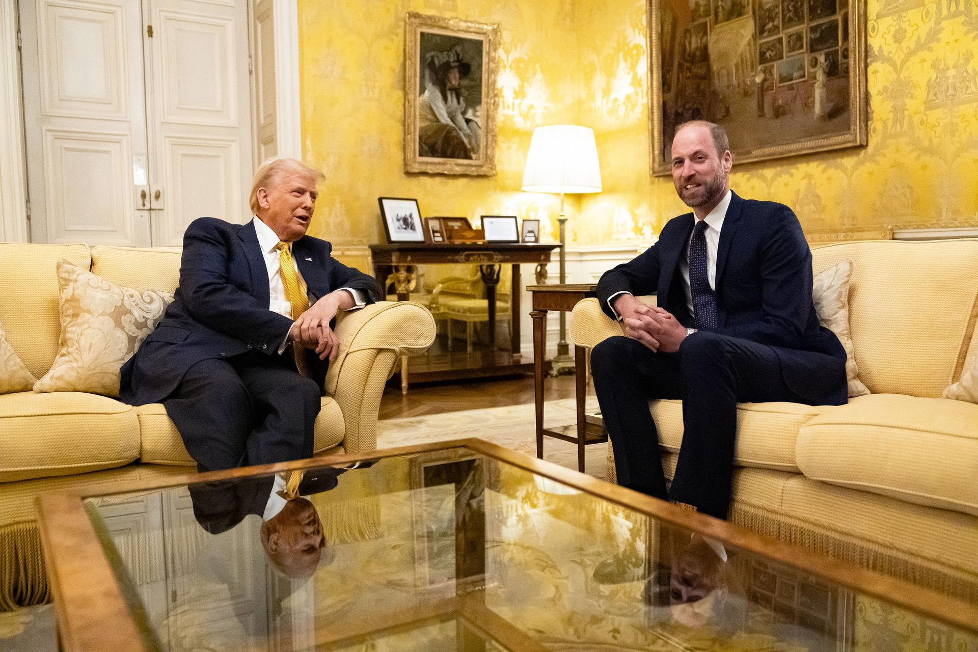 Donald Trump and Prince William sit on sofas at the UK Ambassador's Residence on the day of the reopening ceremonies of the Notre-Dame de Paris Cathedral.