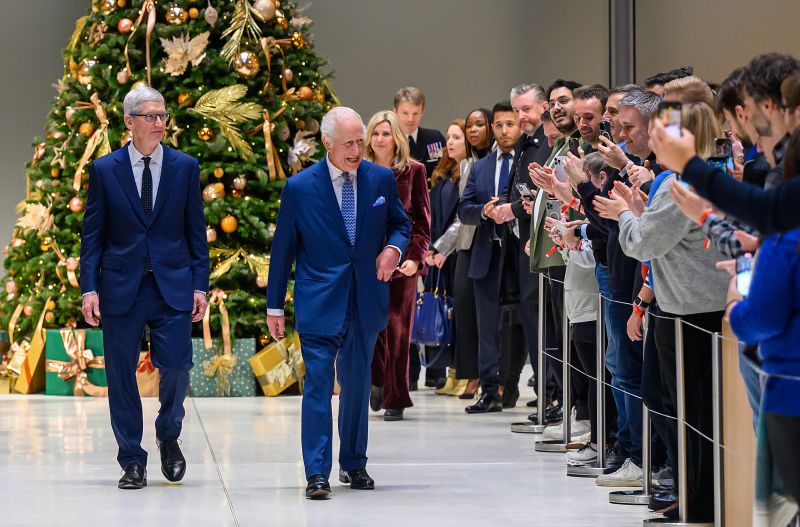 King Charles and Apple CEO Tim Cook meet employees of Apple's UK headquarters in Battersea, London