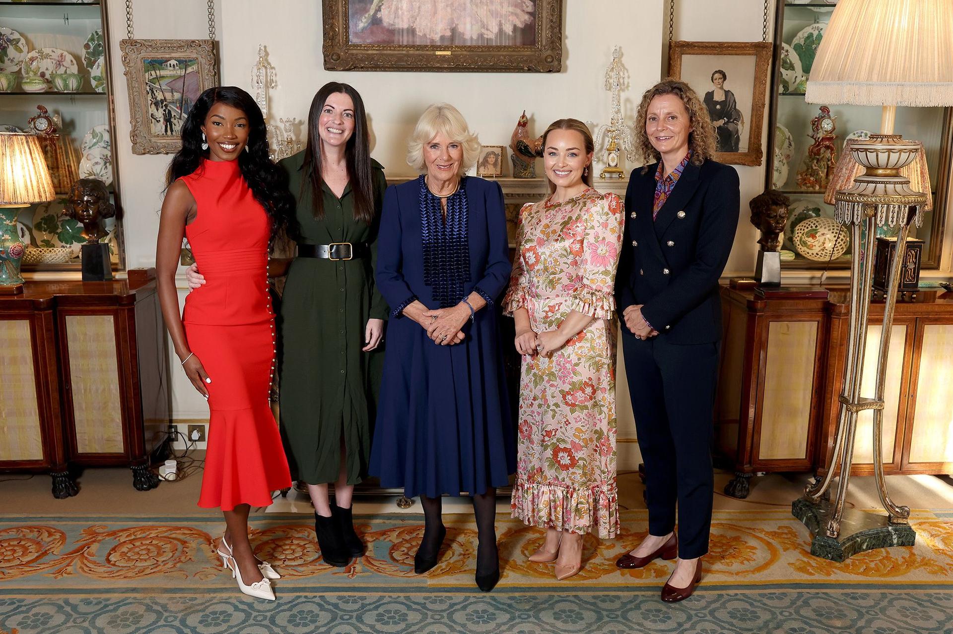 Queen Camilla poses with (L-R) Rehema Muthamia, Emma Armstrong, Alice Liveing and Sharon Baker on October 30, 2024.