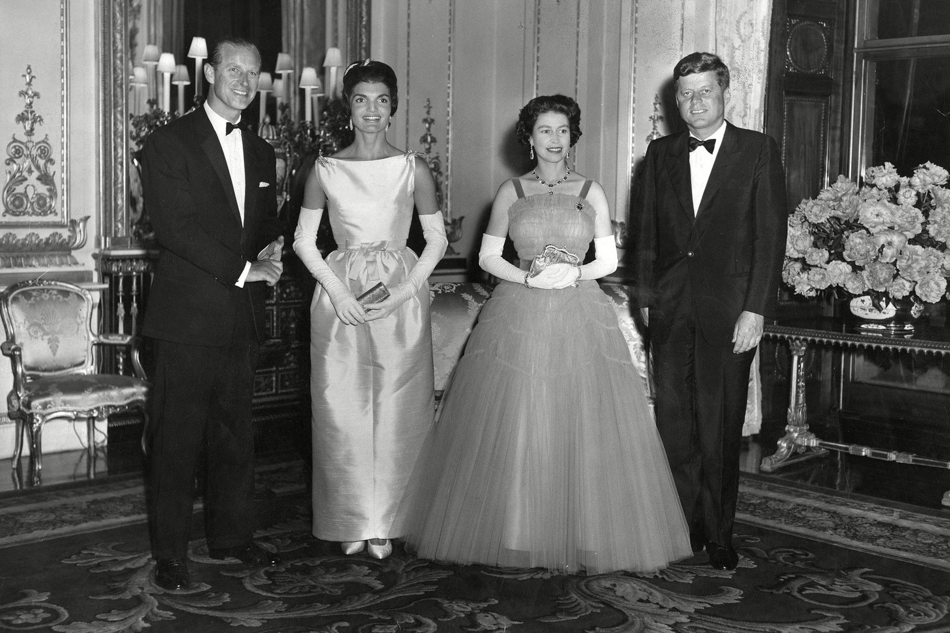 John F. Kennedy and his wife, Jackie, pictured with Queen Elizabeth II and Prince Philip at a state dinner party held at Buckingham Palace during the couple’s visit to London in 1961. 