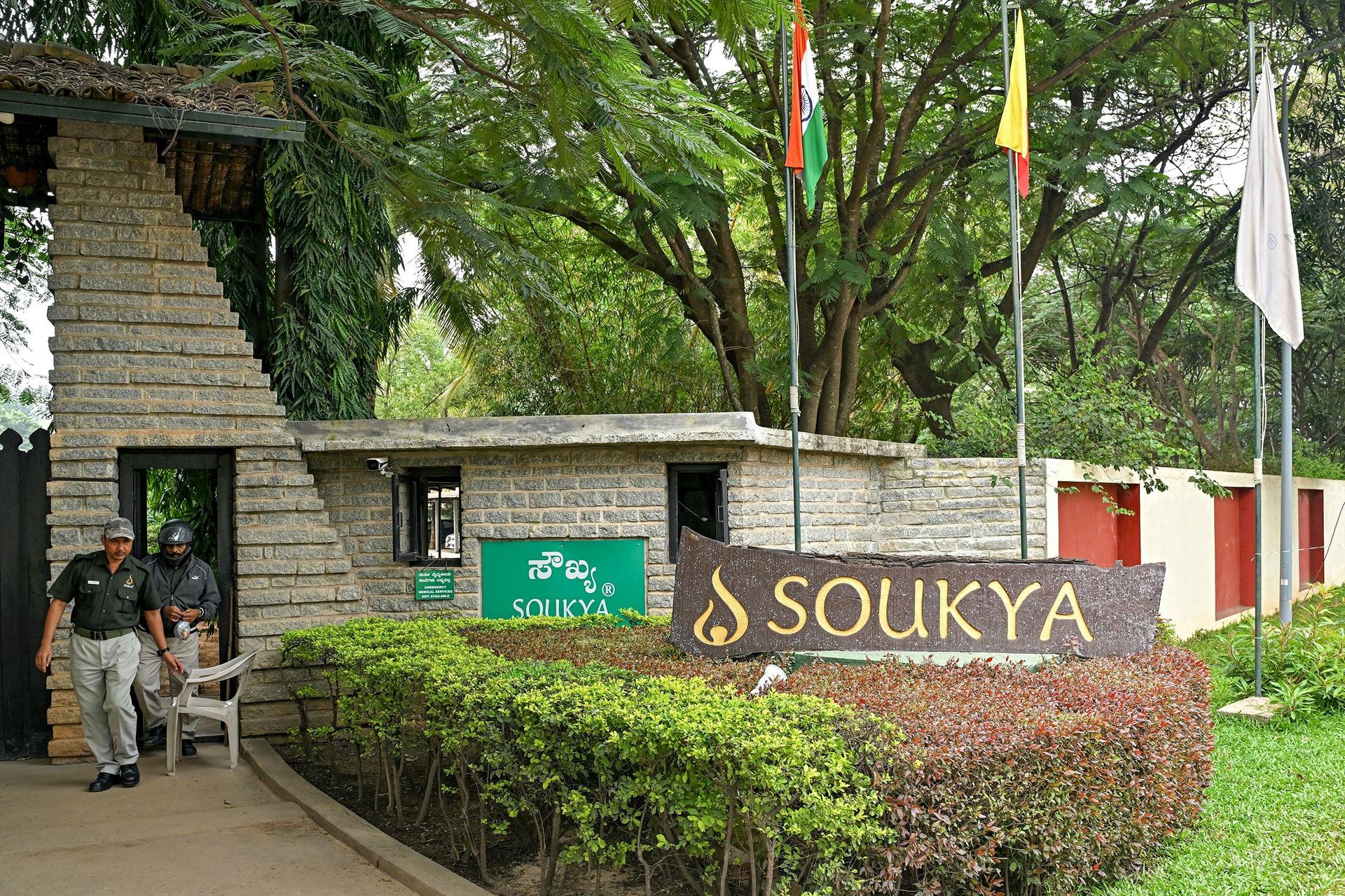 Security personnel stand guard outside the Soukya International Holistic Health Centre (SIHHC) in Bengaluru on October 30, 2024, where King Charles III of Britain and Queen Camilla received wellness treatment.