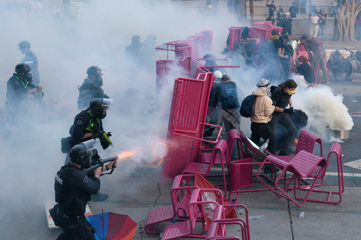 Police clear demonstrators after they blocked a street with a barricade during a protest against federal immigration sweeps in downtown Los Angeles, California, U.S. June 8, 2025.